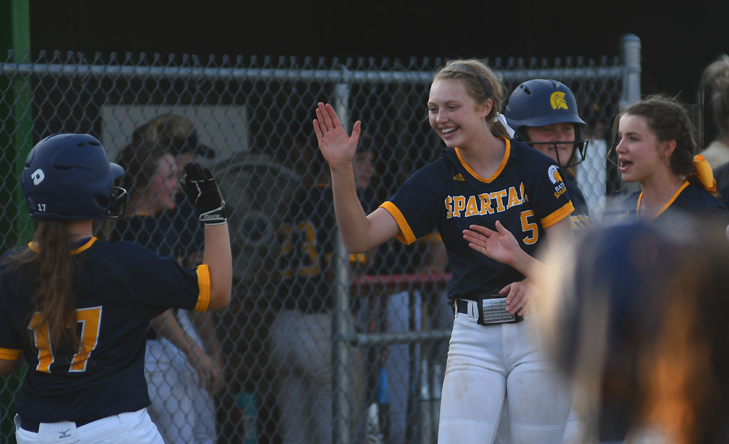 Libby Stiles is greeted by teammates Mya McCubbin and Elijah McCarthy
